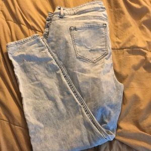 Lightly distressed light blue skinny jeans